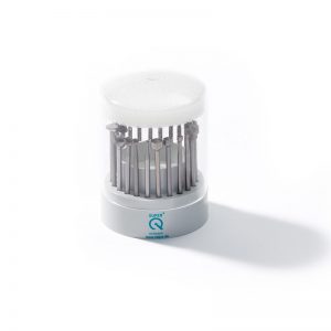 NIQUA SUPER Q 4235 tool steel bur set housed in a stepped cylindrical carousel stand.