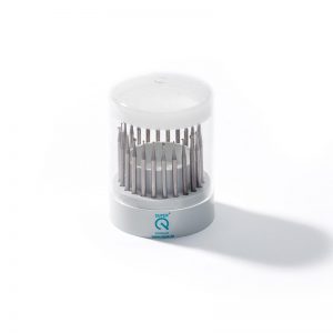 NIQUA SUPER Q 8235 24-piece tool steel bur set housed in a stepped cylindrical carousel stand.