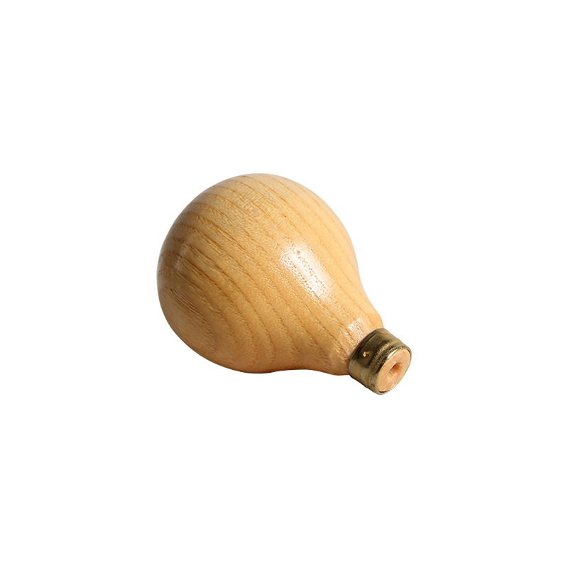 technique® asic handle pear short Angled side view highlighting the rounded teardrop bulb and brass collar of the French beech wood handle.