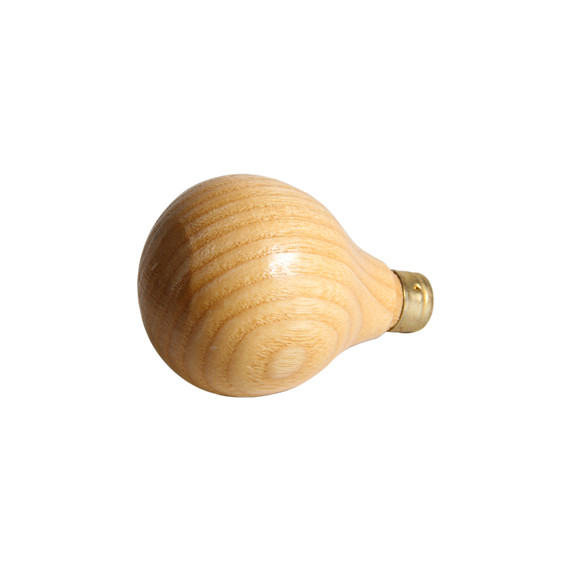 technique® asic handle pear short Side-angled view demonstrating the spherical rear base and natural grain of the PEFC-certified beech wood.