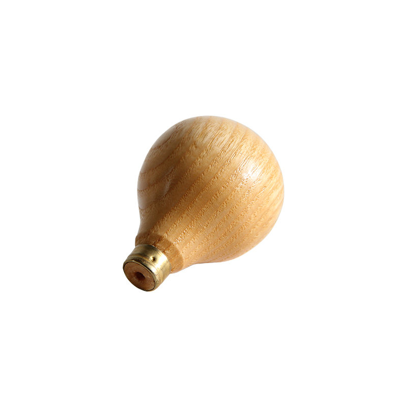 technique® asic handle pear short Top-down angled perspective highlighting the bulbous pear geometry and smooth surface finish.