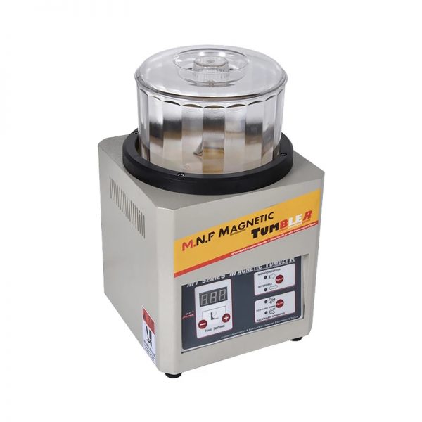 A top-down angled view of the M.N.F. Magnetic Tumbler showing the transparent bowl and control panel.