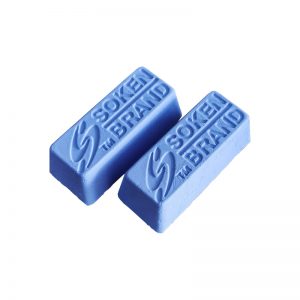 An overhead view of two Soken Brand blue polishing compound bars on a white background.
