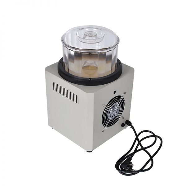 Back view of the M.N.F. Magnetic Tumbler with cooling fan, power cord, and vented side panel.