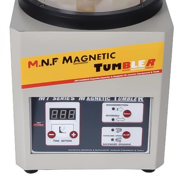Close-up of the M.N.F. Magnetic Tumbler's control panel with digital display and buttons.
