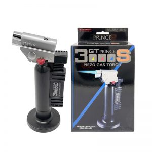 A PRINCE GT-3000SB torch next to its box. The box shows the product and a "New and Improved" label.