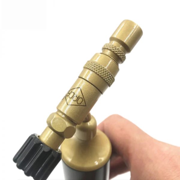A close-up view of the butane torch's nozzle and adjustment knob. The ORCA brand logo is visible on the body.
