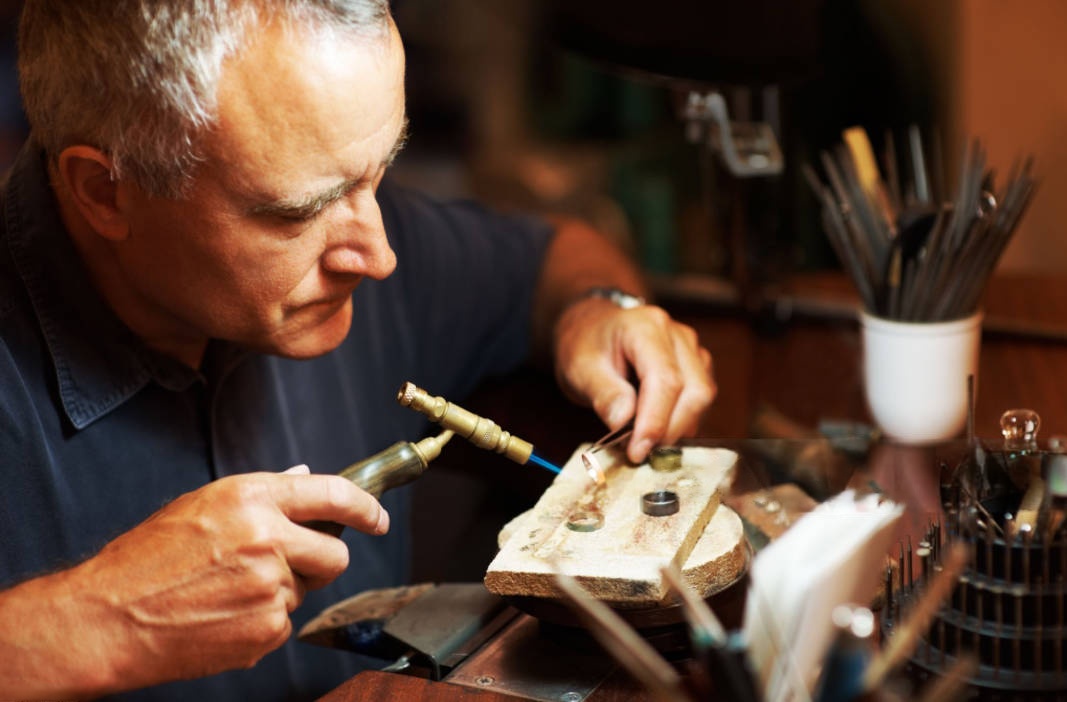 jeweler soldering a ring