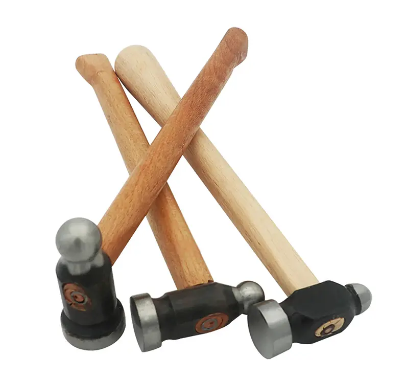 three metal jewelry hammers with wooden handles