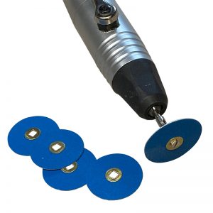 A rotary tool with an attached 22mm 120# Zirconia Sanding Disc and a pile of spare blue discs