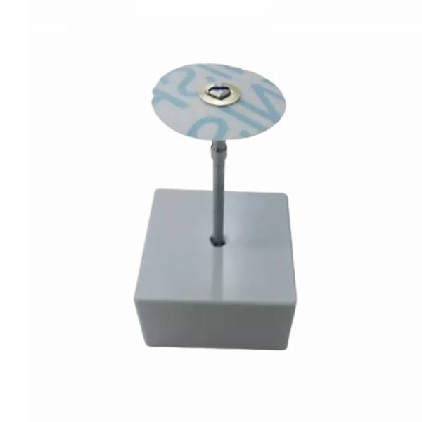 A single 3M Brass Center Aluminum Oxide Sanding Disc with a blue pattern mounted on a white display stand showcasing its design