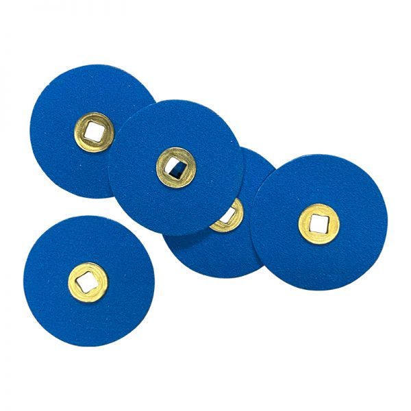 Close-up of 22mm 120# Zirconia Sanding Discs with Brass Centers. Blue abrasive tools for detail work