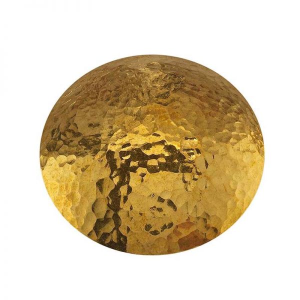 close up of a golden hammered metal disk illustrating the texture created by the fretz large embossing hammer
