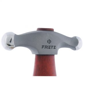 close up of the fretz large embossing hammer head clearly showing its polished domed faces and fretz logo