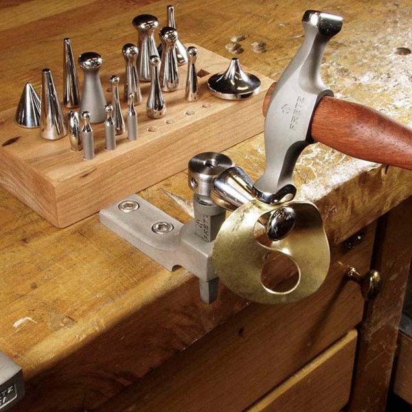 fretz hmr 2 wide raising hammer in action on a workbench shaping metal on a stake demonstrating metal raising
