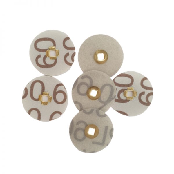 Multiple 3M Brass Center Aluminum Oxide Sanding Discs featuring brown numbers markings