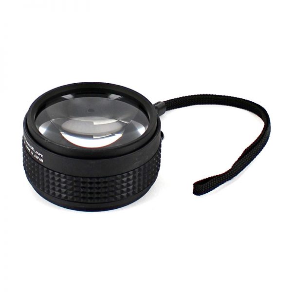 A 5X magnification Hand Grip Loupe with a black lanyard extended out to the right, sitting on a white background