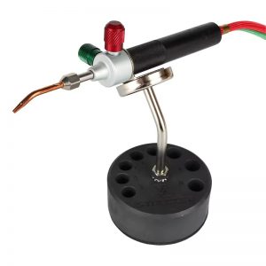A Smith Little Torch is held by the Stuccler Magnetic Stand, demonstrating its use as a third hand