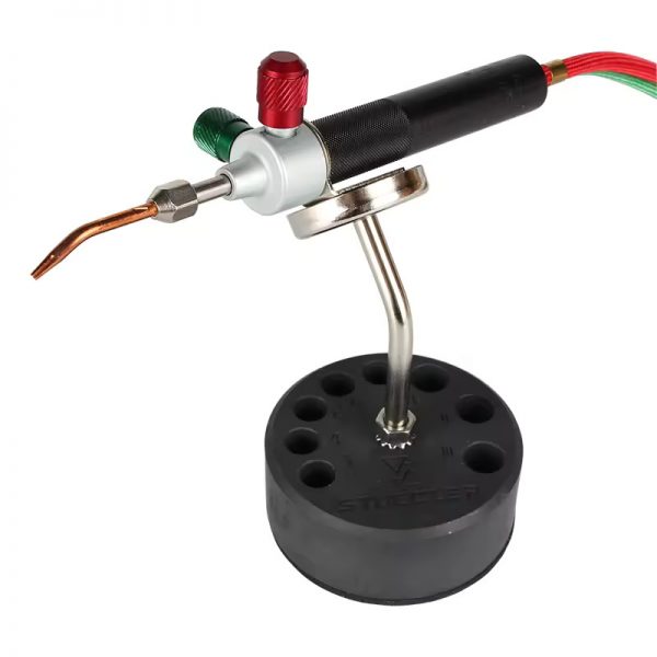 A Smith Little Torch is held by the Stuccler Magnetic Stand, demonstrating its use as a third hand
