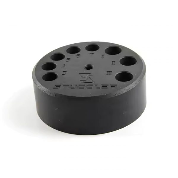 A black cylindrical Stuccler tip organizer with numbered and lettered holes for holding welding tips