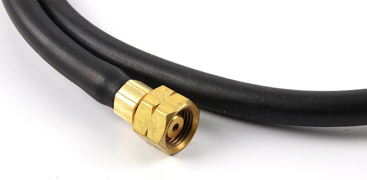 A close-up of a brass fitting on the gas hose, showing connection details for the ORCA M75 CMF kit