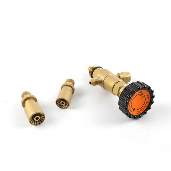 A close-up of the ORCA M75 CRD torch regulator and two different sized nozzles, highlighting their detailed construction