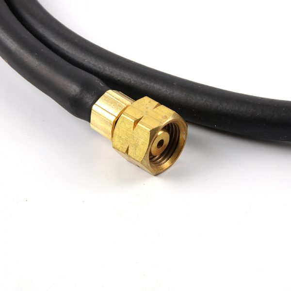A close-up of the brass fitting on the hose of the ORCA M75 CMF jewelers welding torch kit, showing connection details