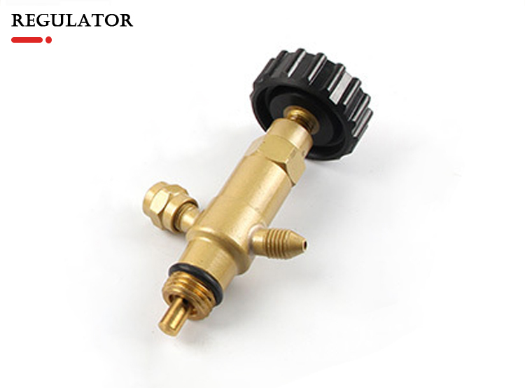 A close-up of the pressure regulator from the ORCA M75 CRD kit, with a black knob and brass fittings for precise gas flow control