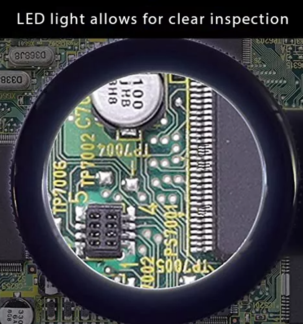 A close-up view through the magnifier, showing a magnified circuit board with an LED light for clear inspection