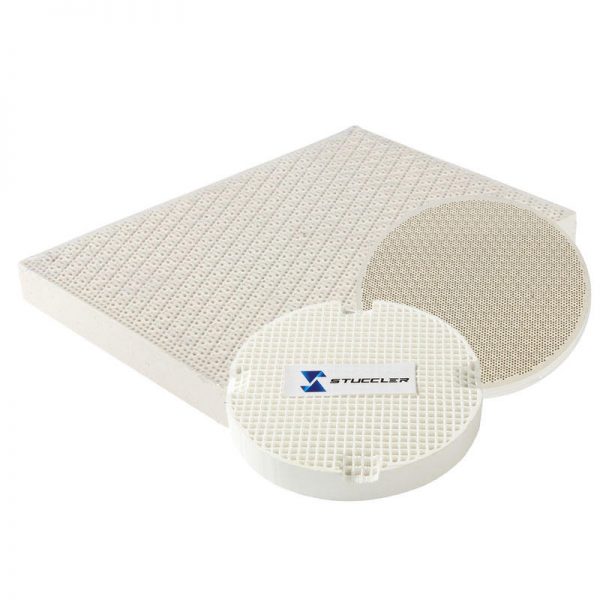 A collection of Stuccler honeycomb quartz soldering tiles in various shapes, including round, square, and rectangular