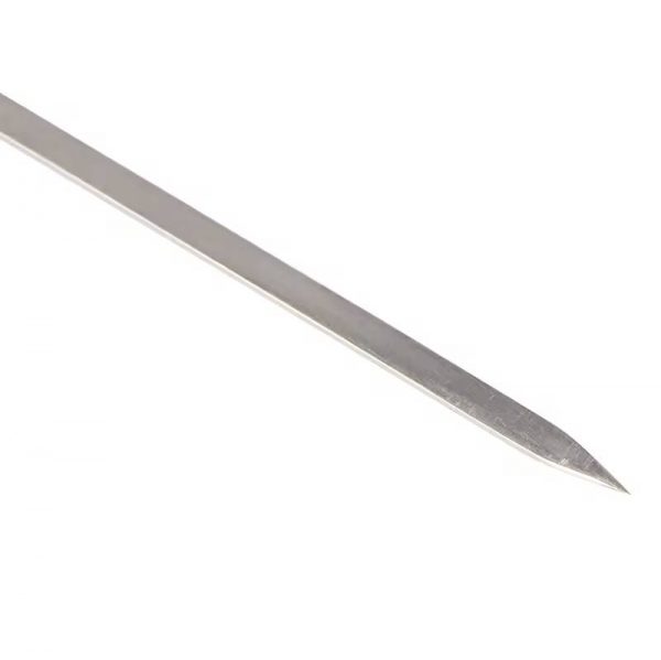 A detailed shot of the pointed tip of the Stuccler ErgoLast titanium soldering pick, designed for precise jewelry work