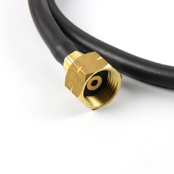 A detailed view of the brass connector and black hose of the Jewelry Welding Torch