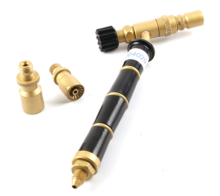 A disassembled view of the ORCA M75 CMK torch body with its various components and nozzle tips
