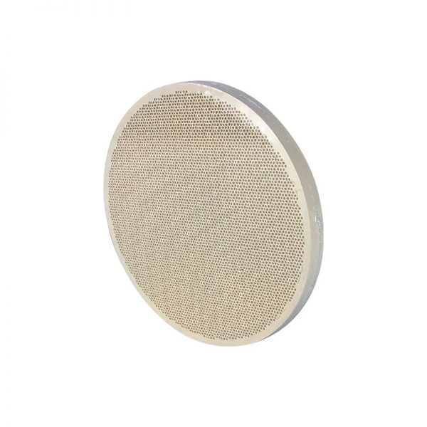 A round Stuccler honeycomb soldering tile with a porous surface, shown from a slightly different angle