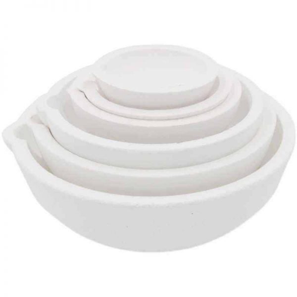 A set of four white Stuccler melting crucibles stacked inside each other, showcasing the different sizes