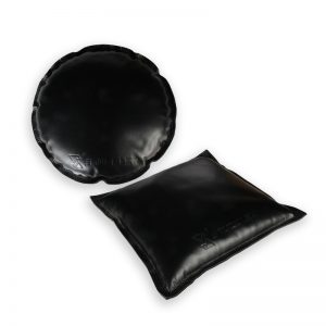 A set of round and square black leather jeweler's sandbags