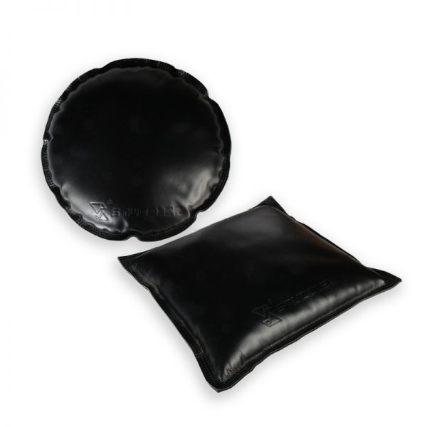 A set of round and square black leather jeweler's sandbags