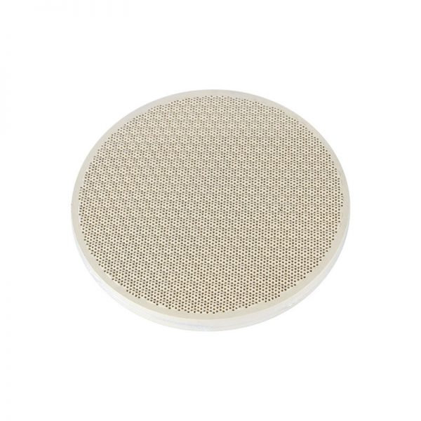 A single round Stuccler honeycomb quartz soldering tile with a porous texture and logo
