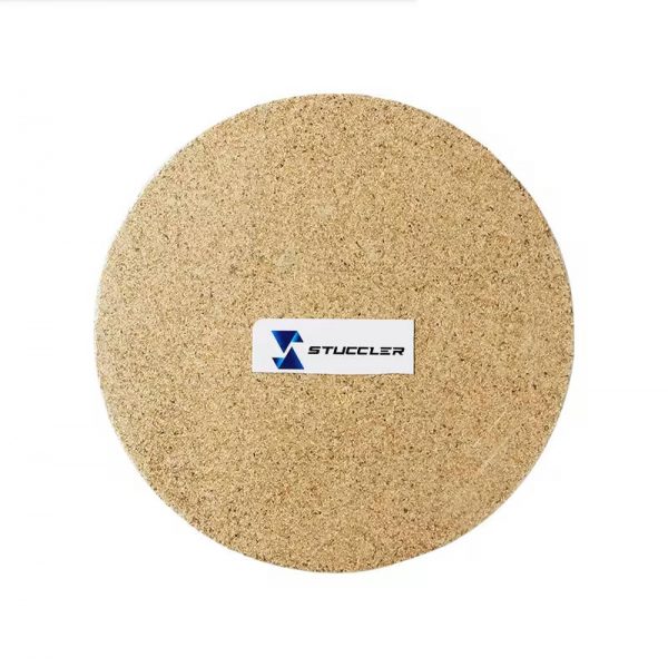 A single round Stucler Skamolex soldering board with the logo, perfect for jewelry making