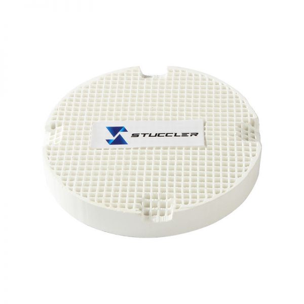 A square, white Stuccler honeycomb soldering tile with a grid-like pattern and the brand logo