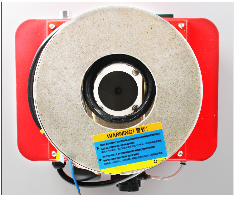 A top-down view of the induction melting furnace, highlighting the heating area and a warning label