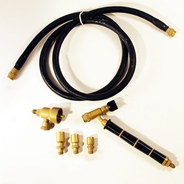 An aerial view of the ORCA M75 CPR jewelry soldering kit, featuring the handle, three nozzles, a coiled hose, and the regulator on a white background