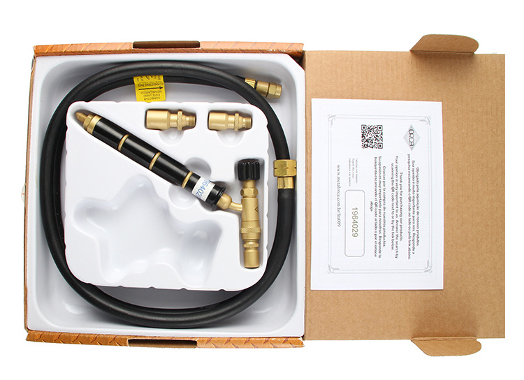 An unboxing photo of the ORCA M75 torch kit, showing all parts neatly arranged inside with the manual