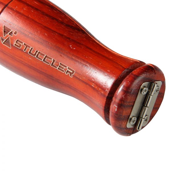 Close-up of the metal hinge and the rich grain of the padauk hardwood on a Stuccler® ring clamp