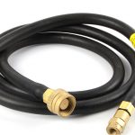 Coiled ORCA M125TK hose with brass fittings, showcasing the connectors on both ends