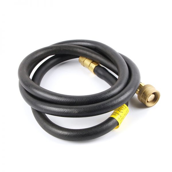 A coiled black rubber hose with a brass connection fitting on each end likely for a soldering torch