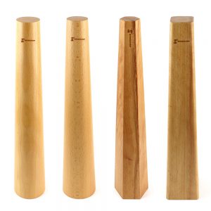 Four Stuccler® wooden bracelet mandrels in different shapes: round tapered, round straight, square tapered, and square straight