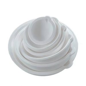 Stack of white Stuccler melting crucibles in various sizes, ranging from 50g to 5kg capacity