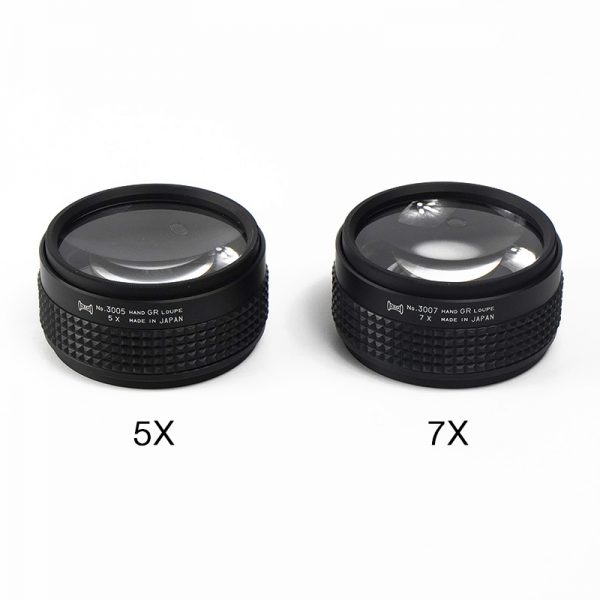 The 5X and 7X magnification Hand Grip Loupes are shown side-by-side on a white background