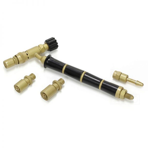 The ORCA M75 jeweler's torch kit, including the torch with a black handle and multiple interchangeable golden accessories, on a white background